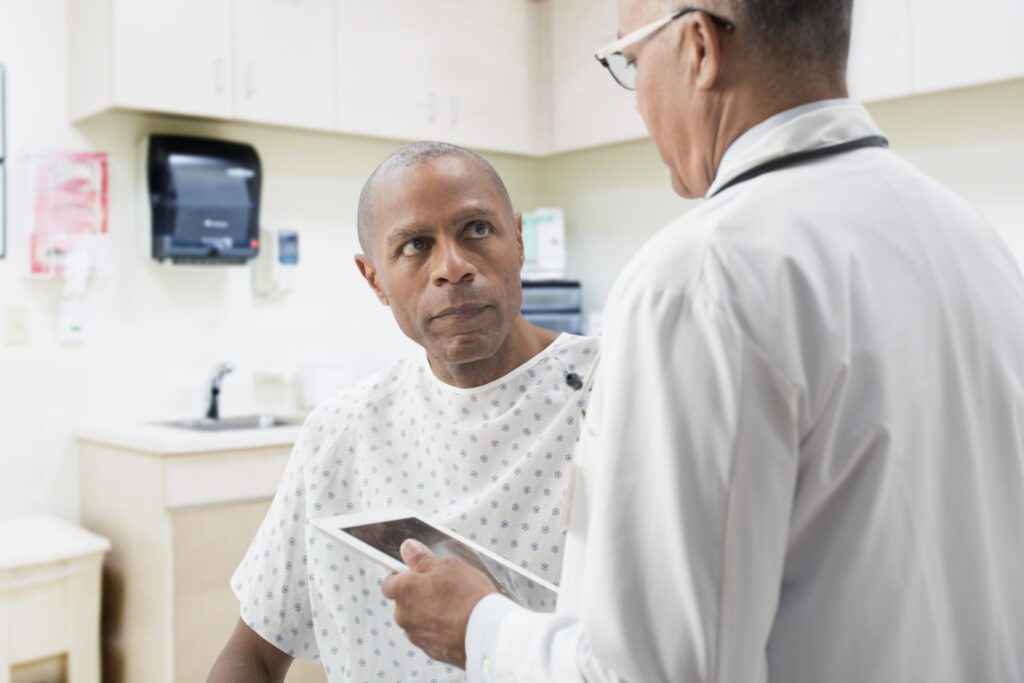 Doctor comforting patient in office