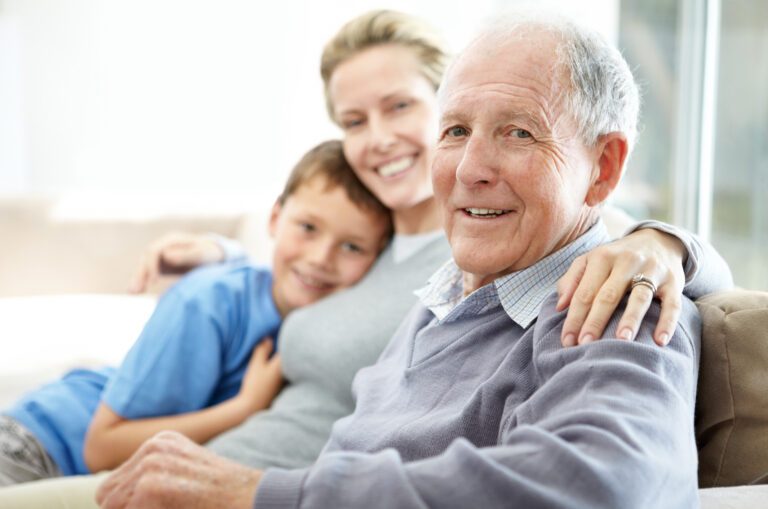 Senior man sitting with his daughter and grandson